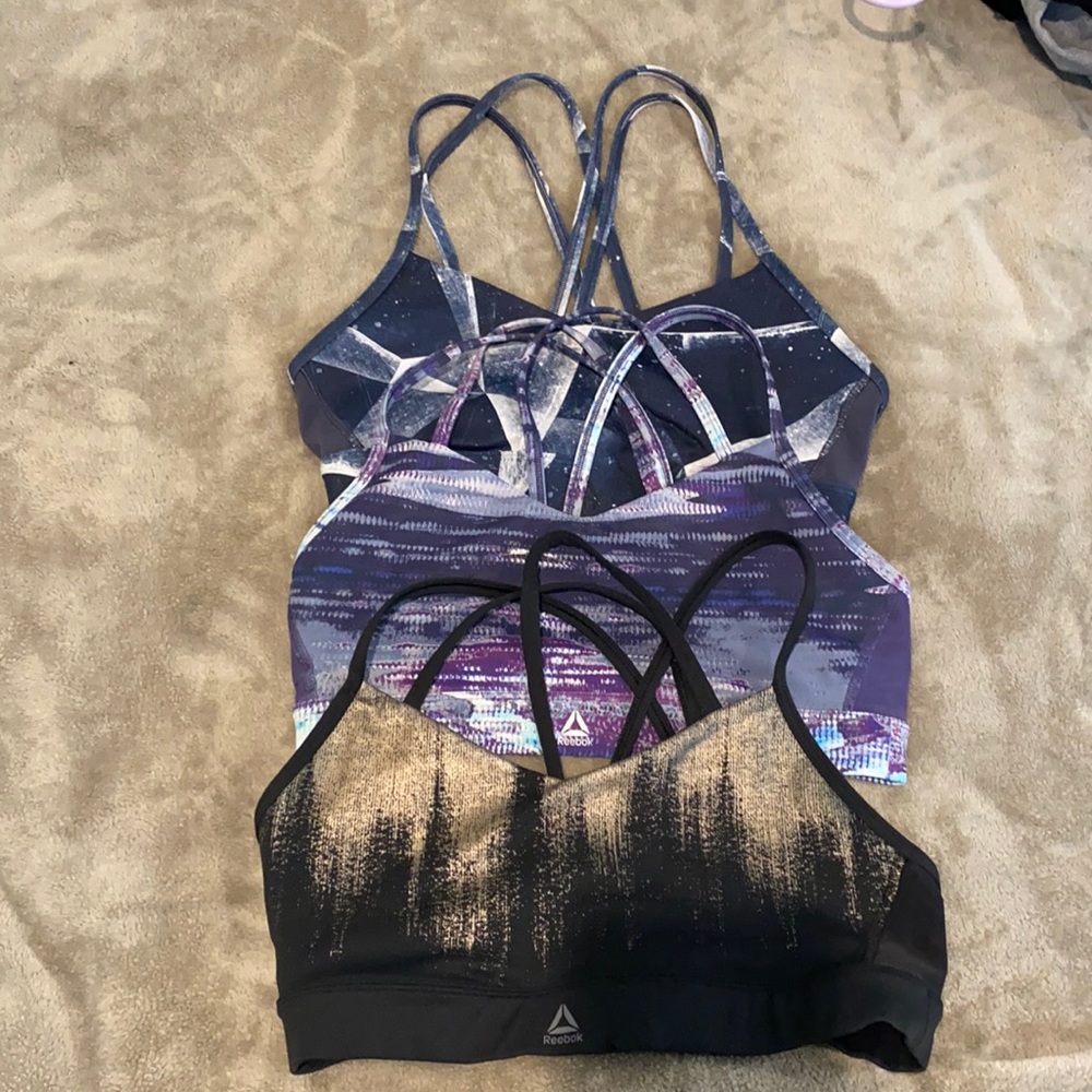 Set of 3 Reebok crossfit style sports bras. Medium but snug. No padding